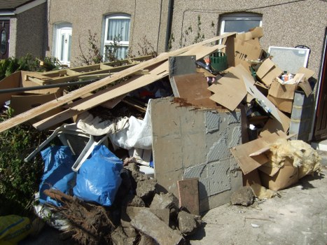 Recycling center processing old furniture in Ealing